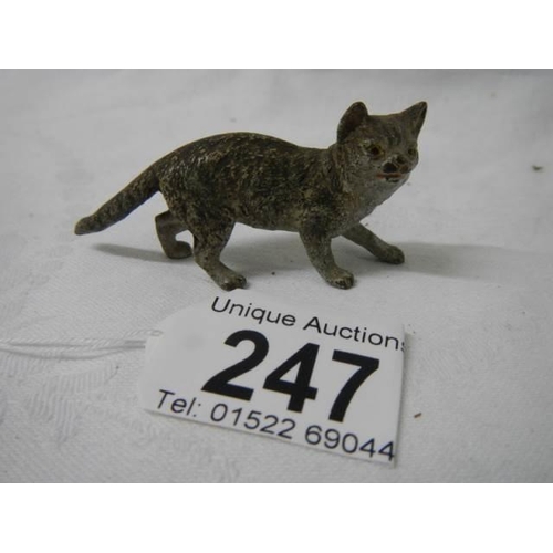 247 - A small painted bronze cat.