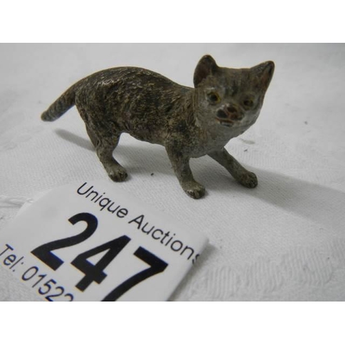 247 - A small painted bronze cat.