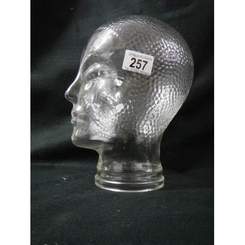 257 - A glass male head.