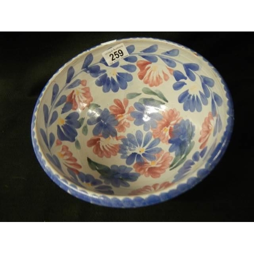 259 - An old hand painted terracotta bowl.