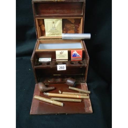 260 - A mahogany smokers box with pipes and cigars etc.,