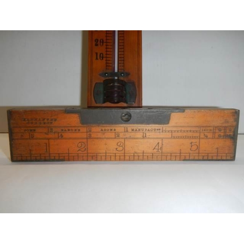 262 - A vintage thermometer and spirit level.