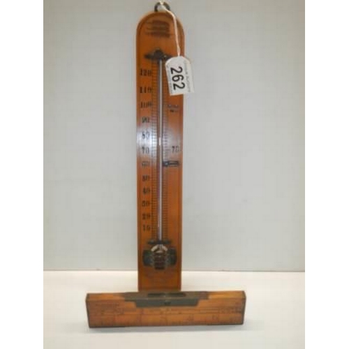 262 - A vintage thermometer and spirit level.