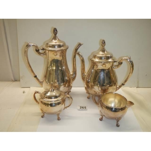 265 - A four piece silver plate tea set.