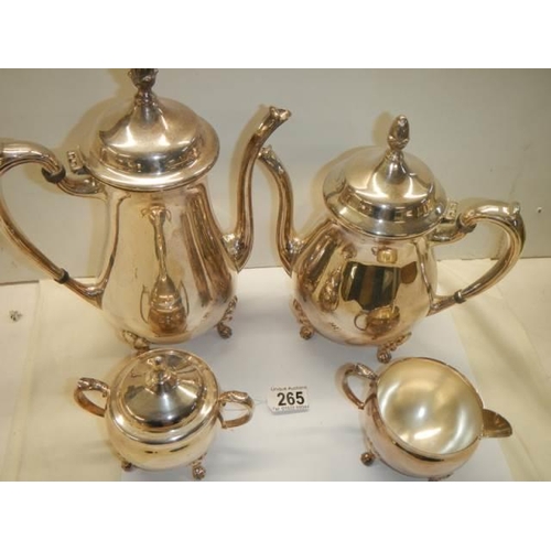 265 - A four piece silver plate tea set.