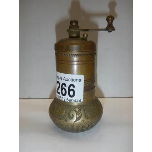 266 - An old brass pepper grinder.