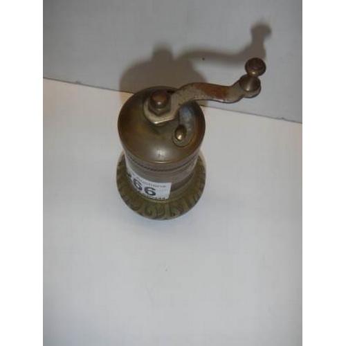 266 - An old brass pepper grinder.