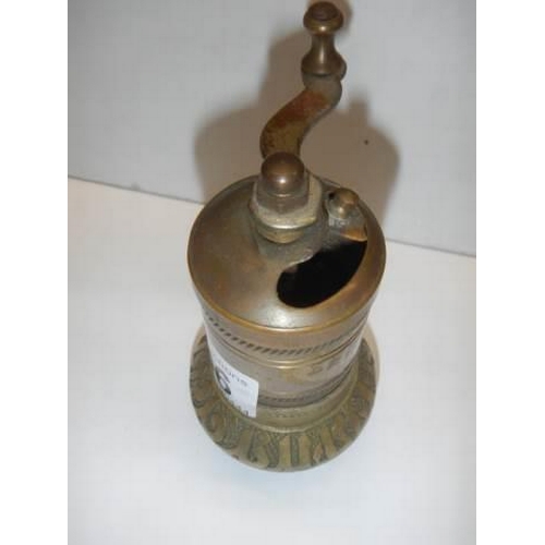 266 - An old brass pepper grinder.