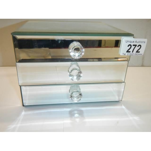 272 - A small three drawer mirrored jewellery chest.