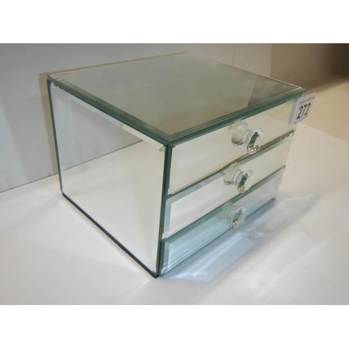 272 - A small three drawer mirrored jewellery chest.