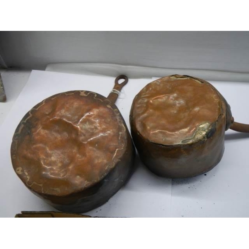 275 - Two old copper saucepans stamped Paris.