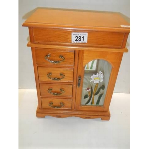 281 - A good quality wooden jewellery cabinet.