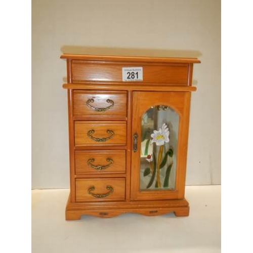 281 - A good quality wooden jewellery cabinet.