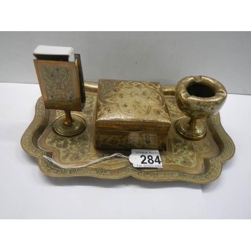 284 - A vintage brass smoker's tray.