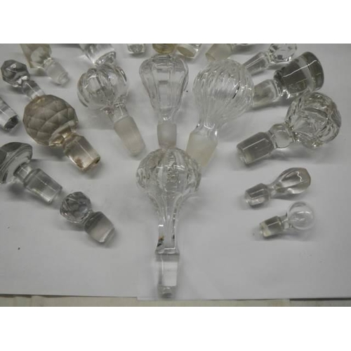 297 - Approximately 20 glass decanter stoppers, various sizes