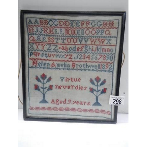 298 - A framed and glazed 1892 sampler by Helen Amelia Brothwell aged nine years.