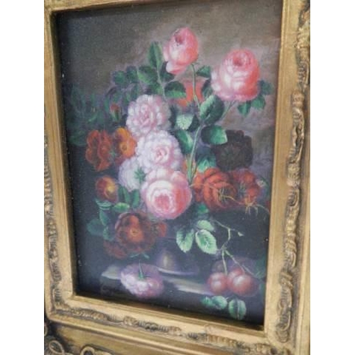 299 - A gilt framed floral display.