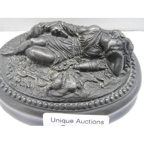 302 - A paperweight featuring a reclining female.