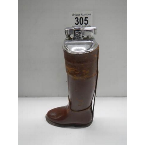 305 - An unusual cigarette lighter in the form of a leather boot.