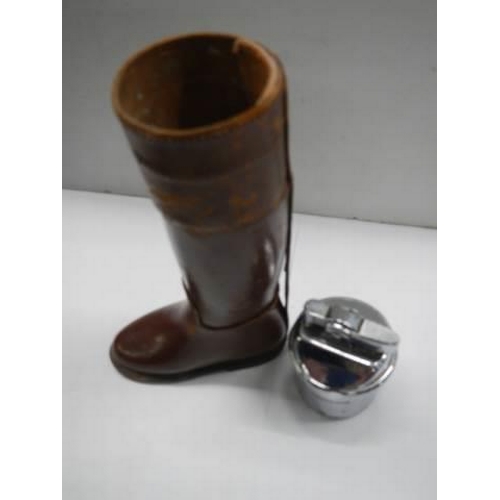 305 - An unusual cigarette lighter in the form of a leather boot.