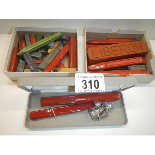 310 - A Wax seal and two trays of sealing wax.