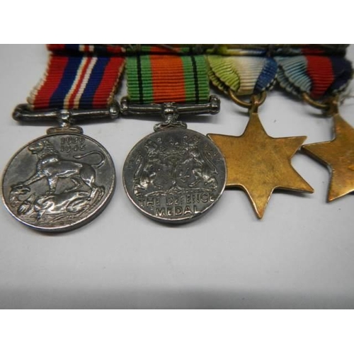 313 - A set of four miniature WW2 medals.