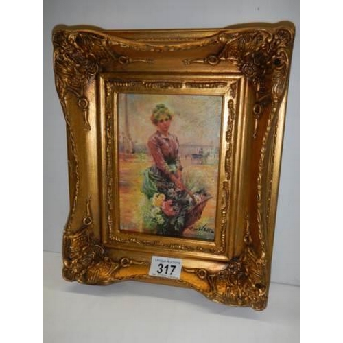 317 - A gilt framed study of a lady with flowers.