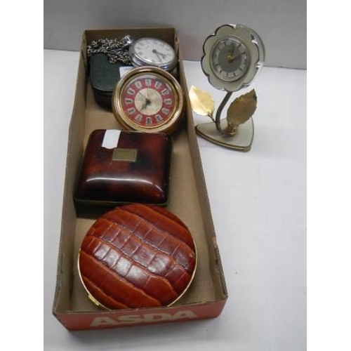 318 - A Smith's pocket watch in working order, 3 other clocks and a pocket watch case,.