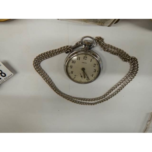 318 - A Smith's pocket watch in working order, 3 other clocks and a pocket watch case,.