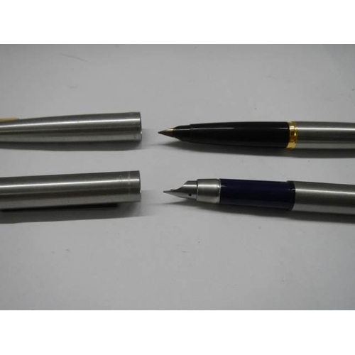 319 - Two Parker fountain pens.