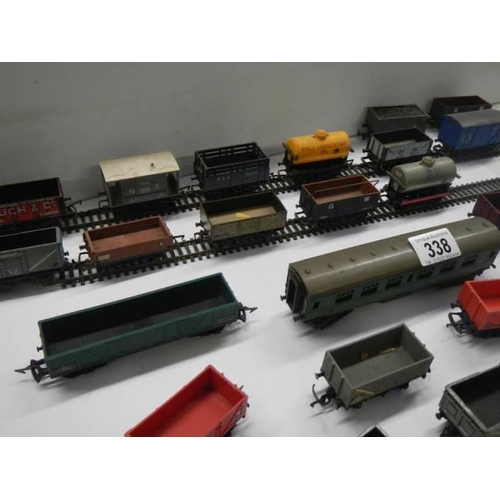 338 - A quantity of model railway goods wagons etc.,