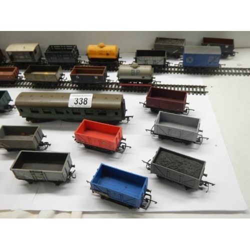 338 - A quantity of model railway goods wagons etc.,