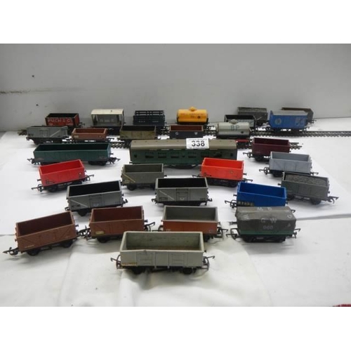 338 - A quantity of model railway goods wagons etc.,