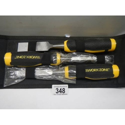 348 - A set of three new Workzone chisels in case.