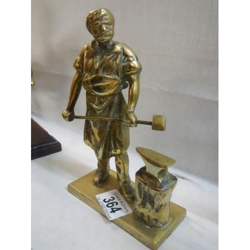 364 - A solid brass blacksmith figure.