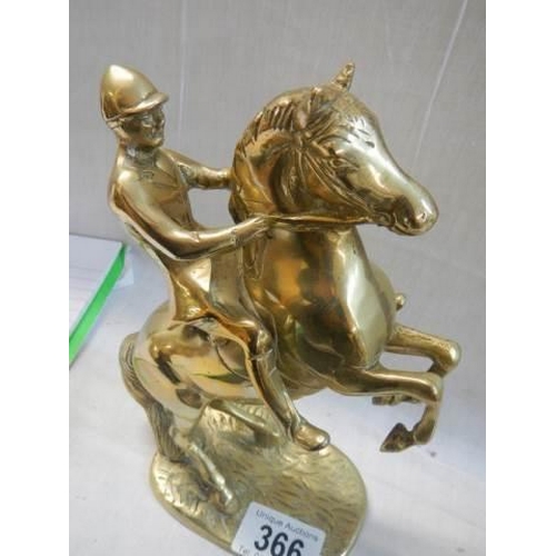 366 - A solid brass rearing horse figure.