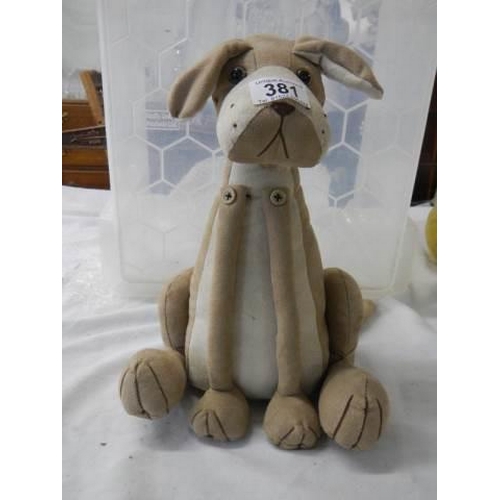 381 - A dog doorstop.