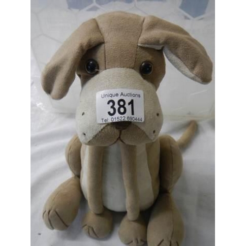 381 - A dog doorstop.