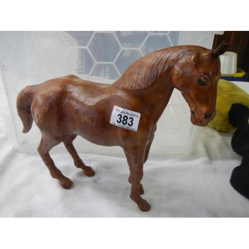 383 - A leather horse figure.