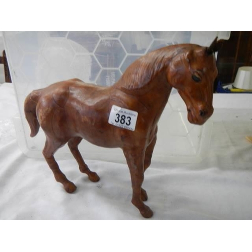 383 - A leather horse figure.