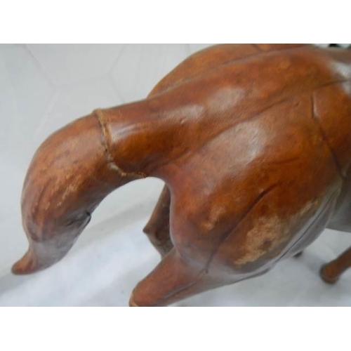 383 - A leather horse figure.