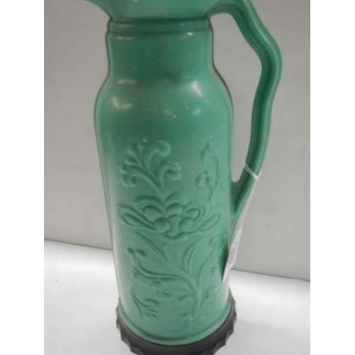 397 - A vintage green bakelite hot water flask by 'The British Vacuum Flask Co.,'