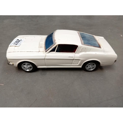 A Japanese Bandai tin plate battery operated Ford mustang fastback (Battery  compartment clean, worke