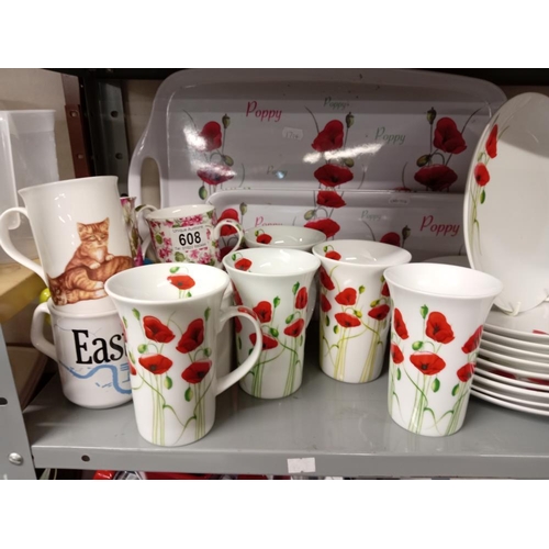 608 - A quantity of Poppy mugs, Tray & Part dinner service