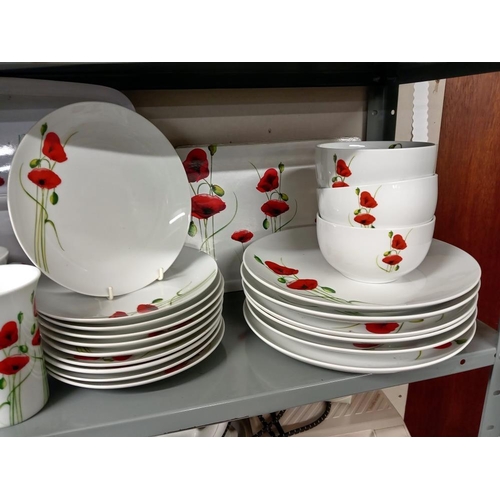 608 - A quantity of Poppy mugs, Tray & Part dinner service