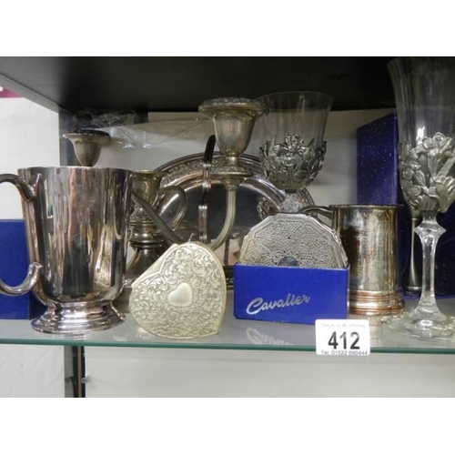 412 - A good lot of boxed and un-boxed silver plate.