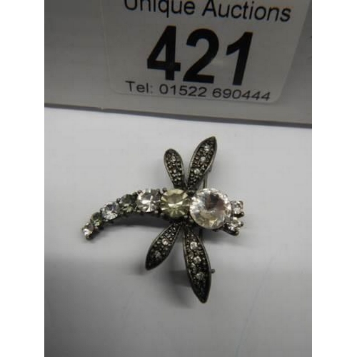 421 - A bee brooch set white stones.