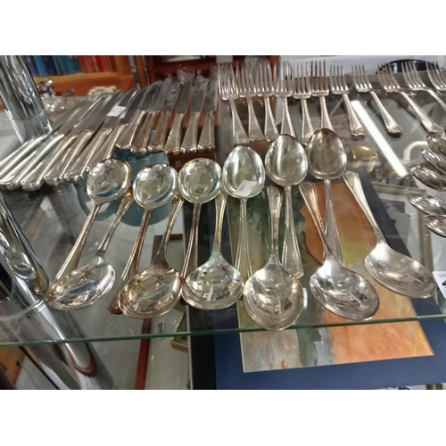 550F - An Insignia plate cutlery. 6 Place settings