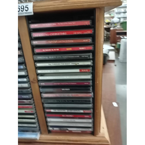 695 - A CD rack & CD's