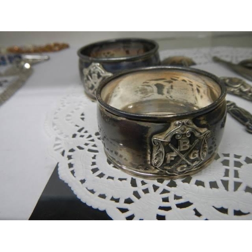 443 - Two silver napkin rings, silver handled button hook and three other items of silver.